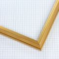 This 3/4 " profile frame features a very small edged extended back design with a delicate lip, finished in genuine gold leaf. Its graceful contours and luminous golden tone offer a refined, classic elegance—perfect for enhancing fine art, photography, or traditional décor.