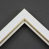 Linen liners are a great option for providing white space between art and frame.  Where glass is generally required to protect paper artworks and their mat, a linen liner does not require glass, making it ideal for paintings and Giclée prints.

This 1.25 inch white liner has an authentic, soft linen texture and a gold and painted white lip.  It is best suited to small and medium size canvas prints, watercolour or oil paintings.